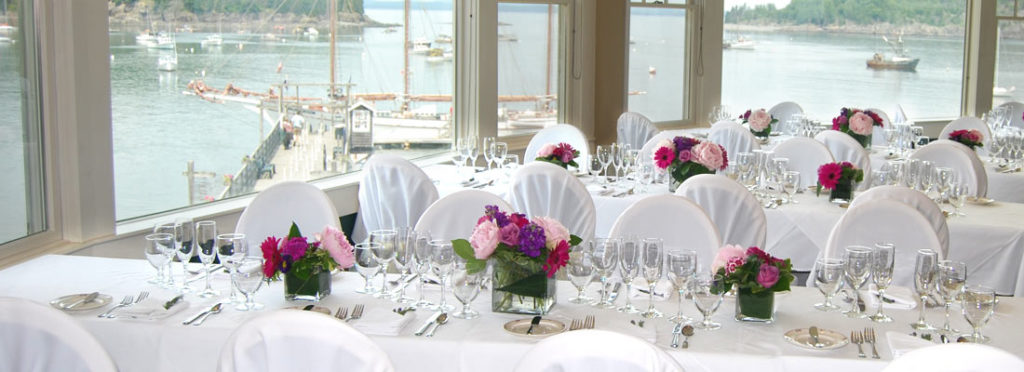 Photo of the Bar Harbor Inn Reading Room Restaurant set up for a wedding reception.